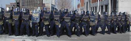 A chorus line of cops: defending the perimeter.