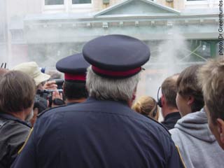 The cops close in on Marc in the midst of supporters and smoke