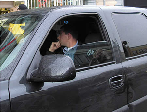 DEAgents cower in their black vehicle
